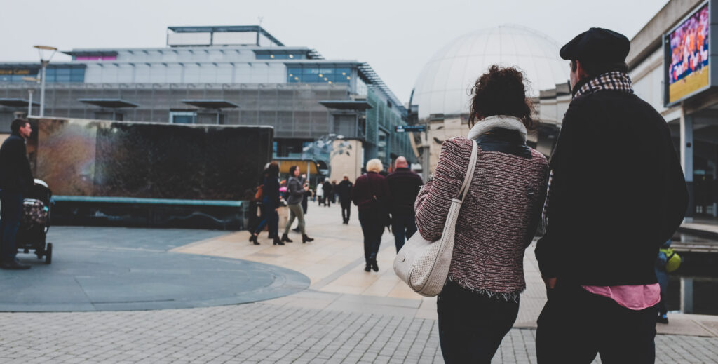 Couple entering Millennium Square, Bristol